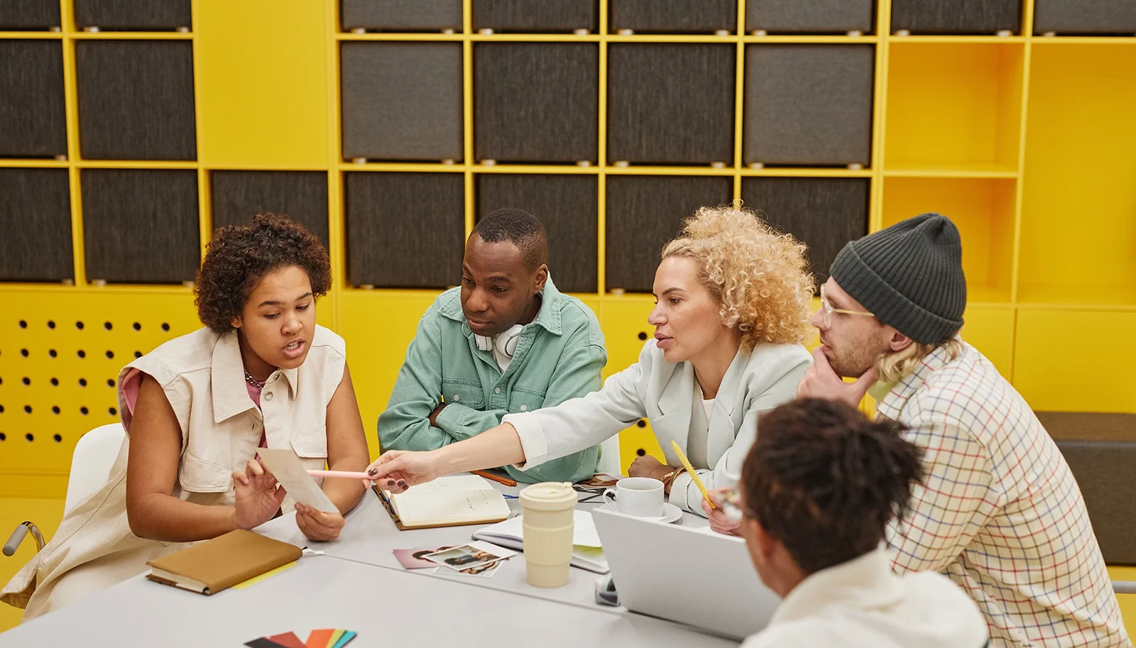 group of coworkers collaborating on a table