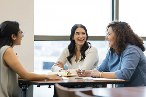 three smiling hiring ladies
