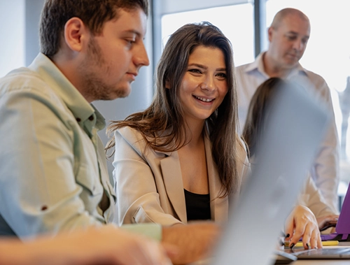 woman smiling with colleagues
